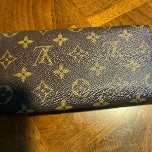 LV monogram place for cards, zipper is good condition, and cards area.